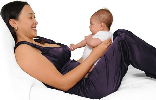 Ella bonds with Naomi in cozy luxury in the Deep Purple nursing pajamas. 