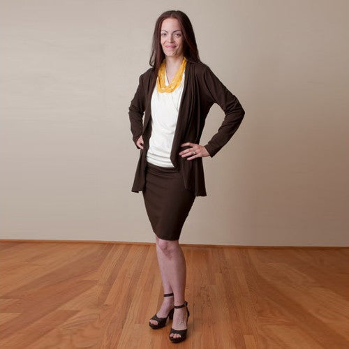 Ophelia wears the Jet Set Jacket and Skirt with the included Ivory Sleeveless Crossover Shirt.