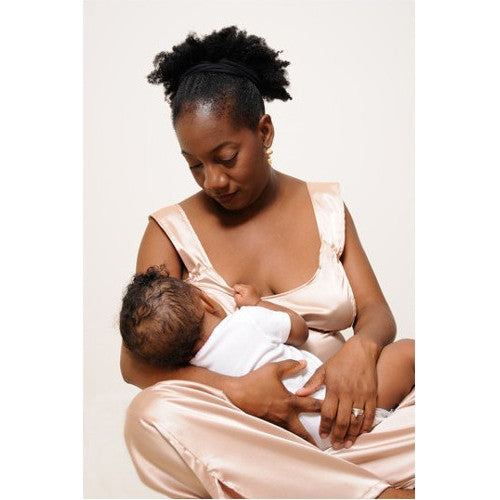 Teri nurses Zoe with ease, grace and no skin exposure in her HadleyStilwell Gold Dust nursing pajamas. There is nothing to unfasten or unclip and the openings in the camisole are angled to lie closed when not accessing them.