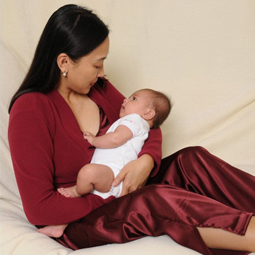 Ella wears the coordinating HadleyStilwell Cranberry Fleece Crossover Top with the Chianti pajamas.