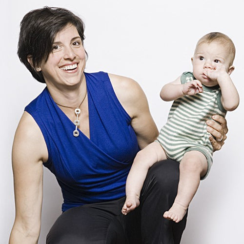 Jackie wears the Royal Blue Crossover Shirt with black capris for a work outfit that allows her to pump at the office without having to get undressed.