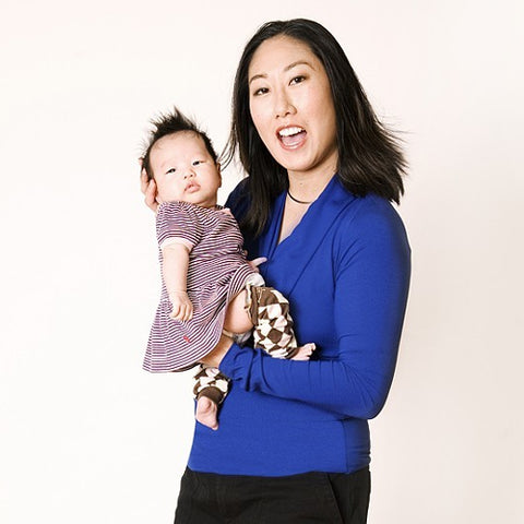 Sue wears the HadleyStilwell Royal Blue Crossover Shirt to give a splash of color to her basic black pants.